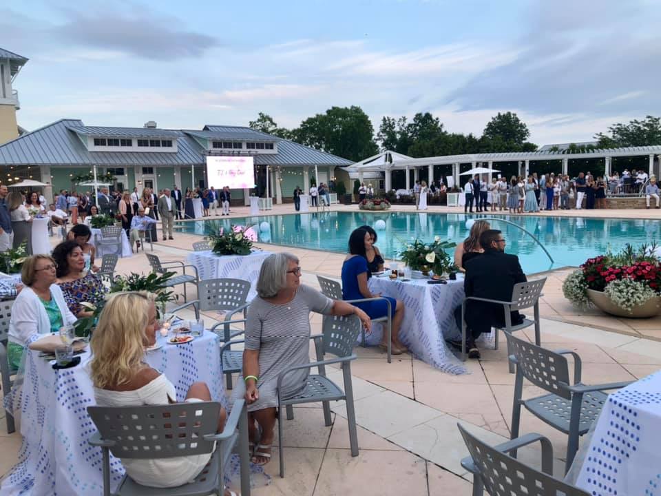 large event outside by an inground pool