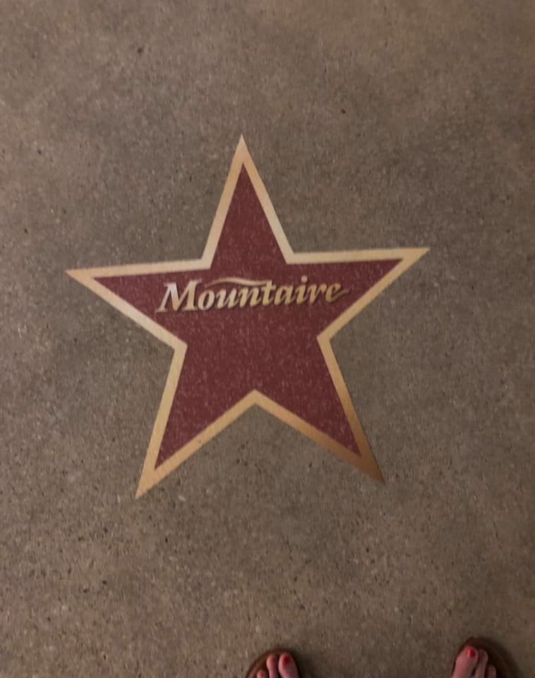 mountaire pink and gold star on the sidewalk