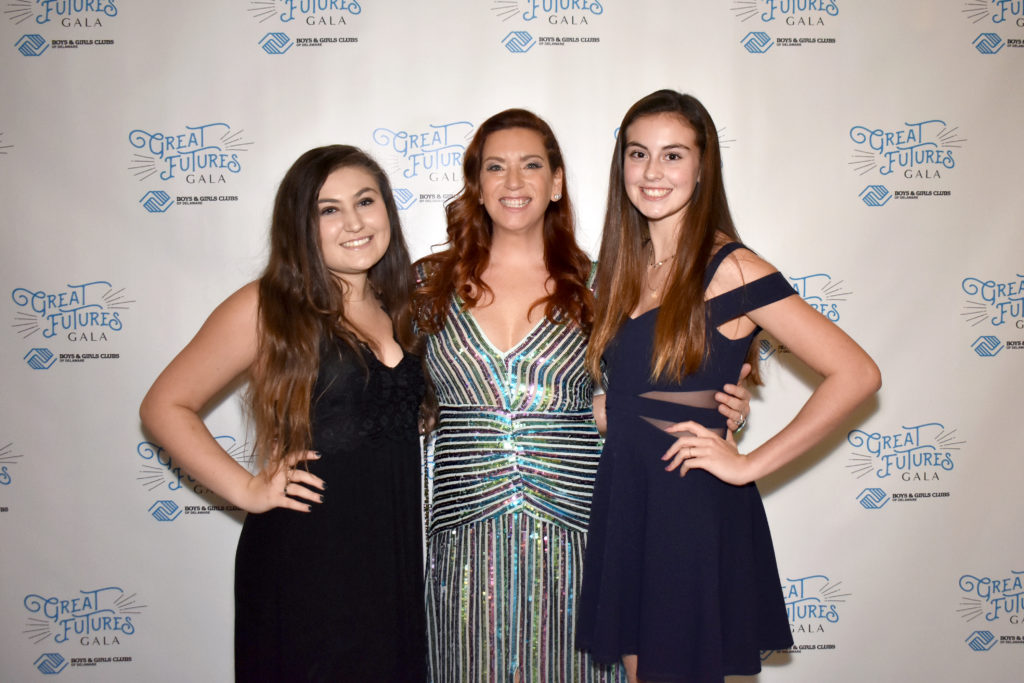 three girls dressed up at the great futures gala