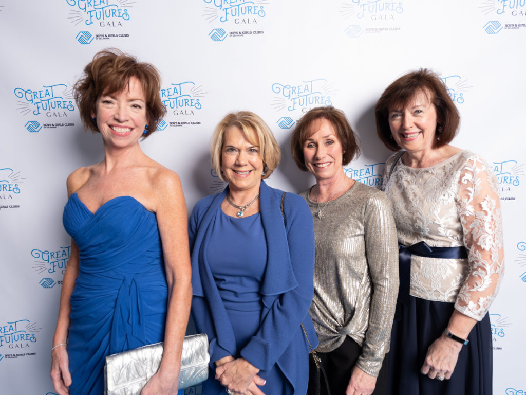 four women dressed up at the great futures gala