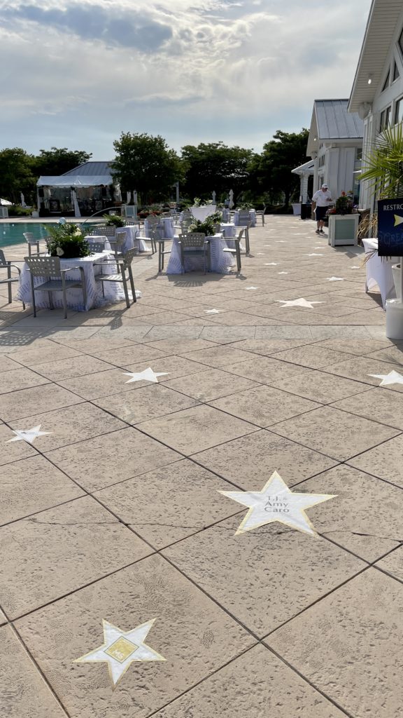 white and gold stars in the sidewalk